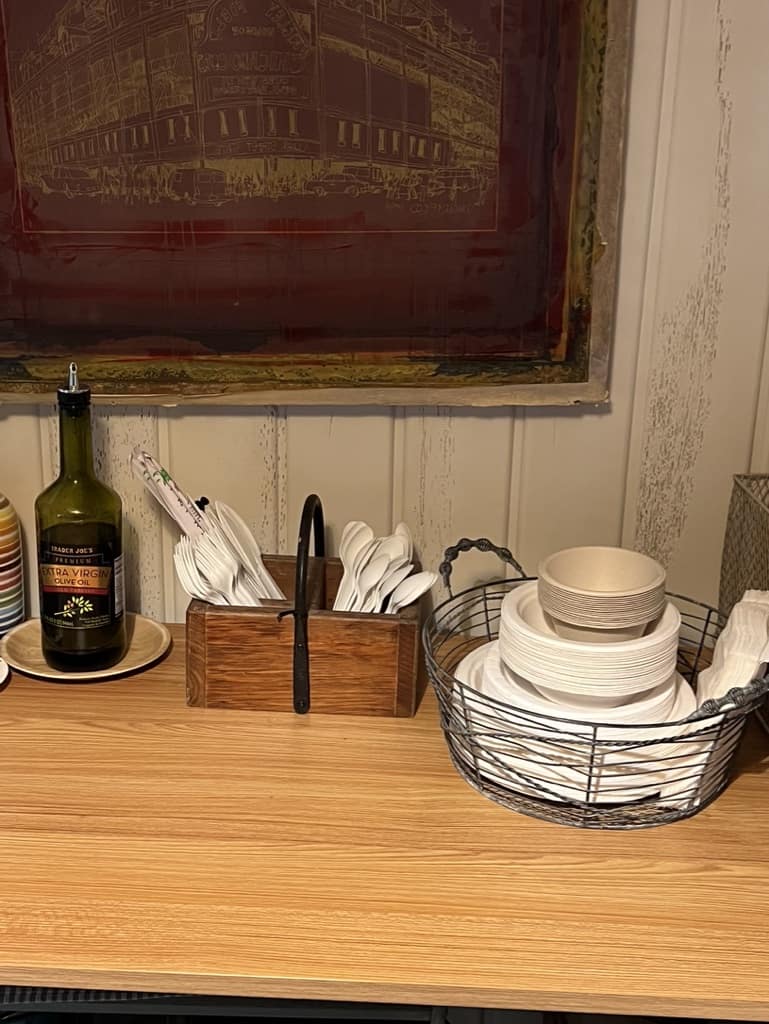 Close up of compostable plates, bowls and cutlery in the temporary kitchen.