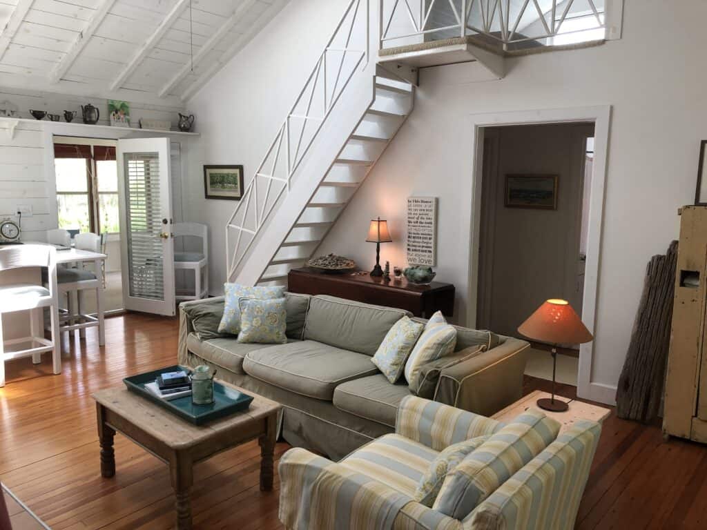 Living room with stairs going up to sleeping loft