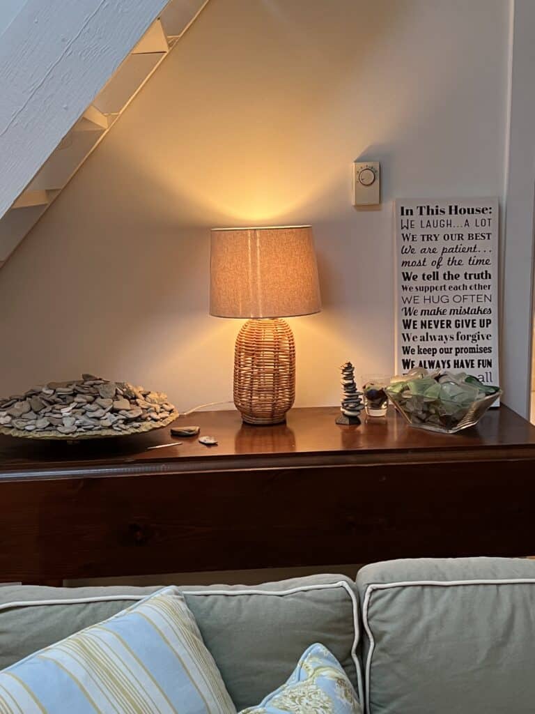 Table with a bowl of heart rocks and a bowl of beach glass