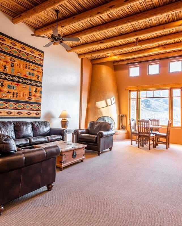 A southwestern living room with leather sofa and chairs