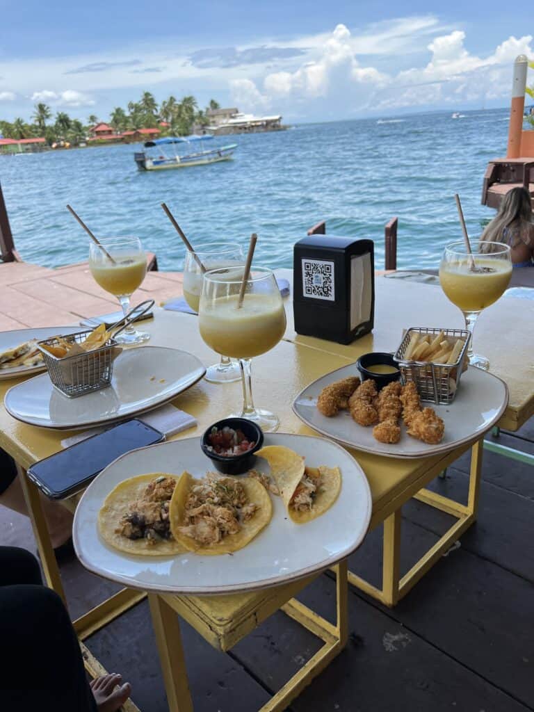 Photo of food on a table at a restaurant on the waterfront.