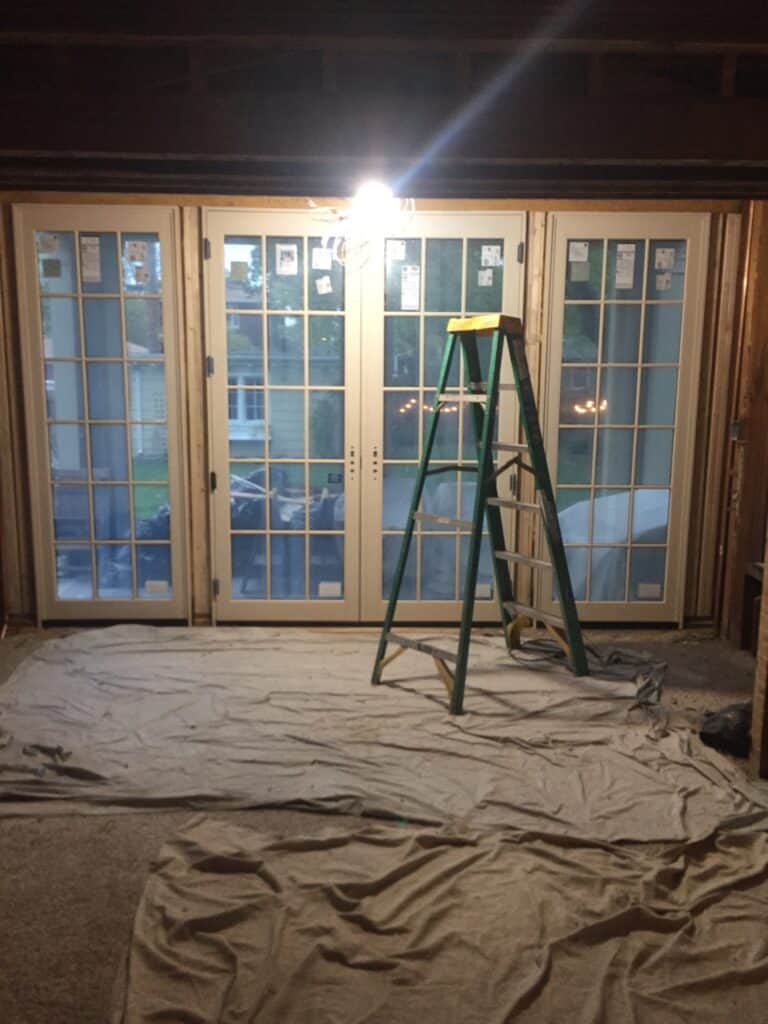 After, the entire wall is now floor to ceiling windows and French Doors. 