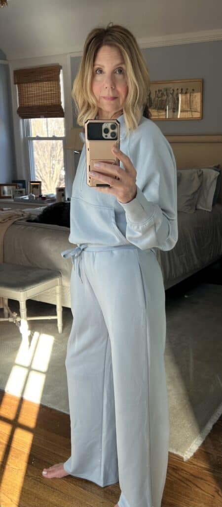 Woman in a light blue, 2-piece matching set.