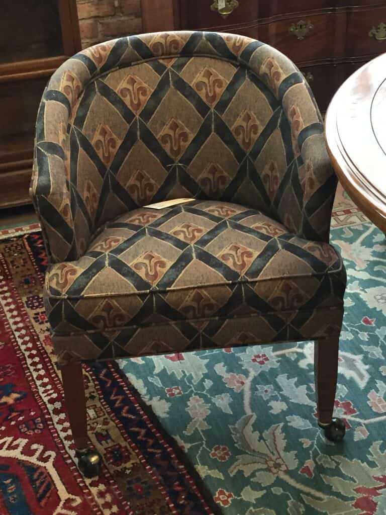 Close up of a chair before it was reupholstered.