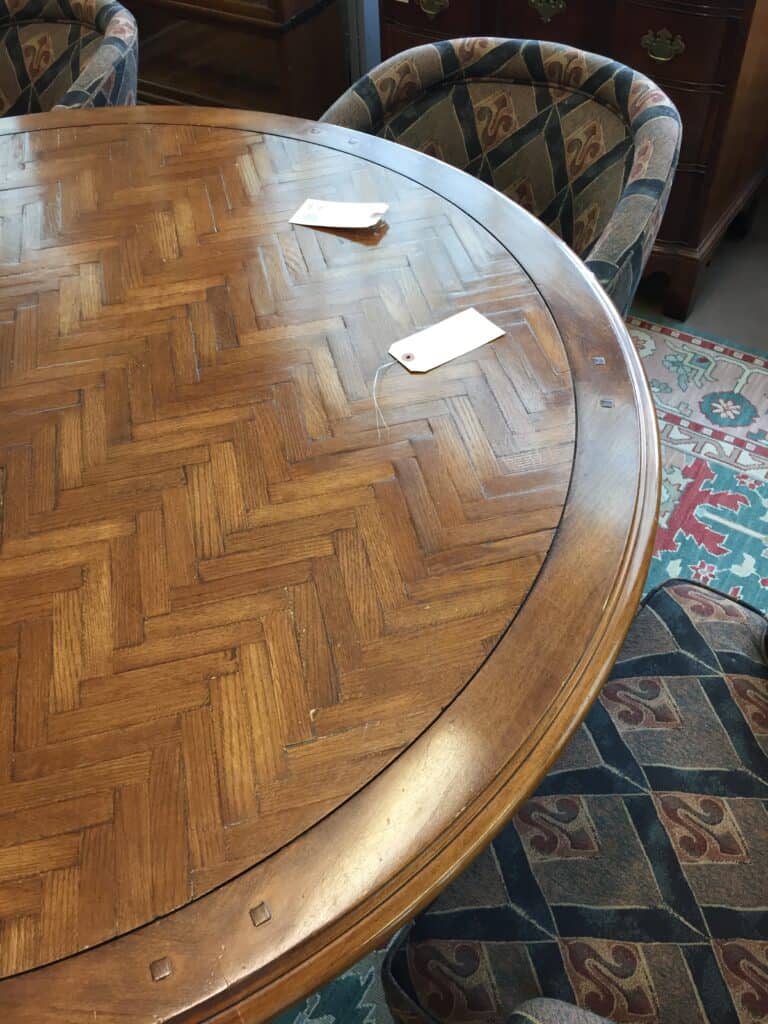 Close up photo of a parquet wood table taken during the preview at the auction house.