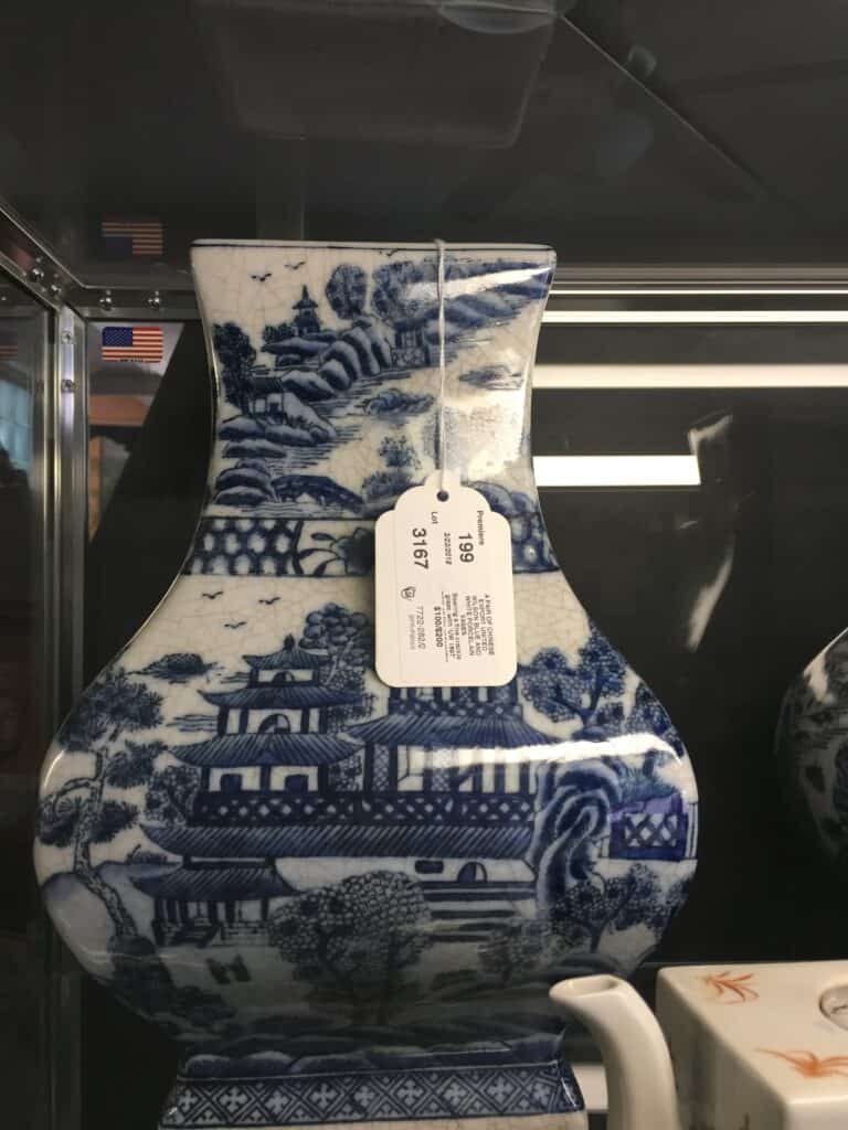 close-up photo of a Chinese, blue and white vase.