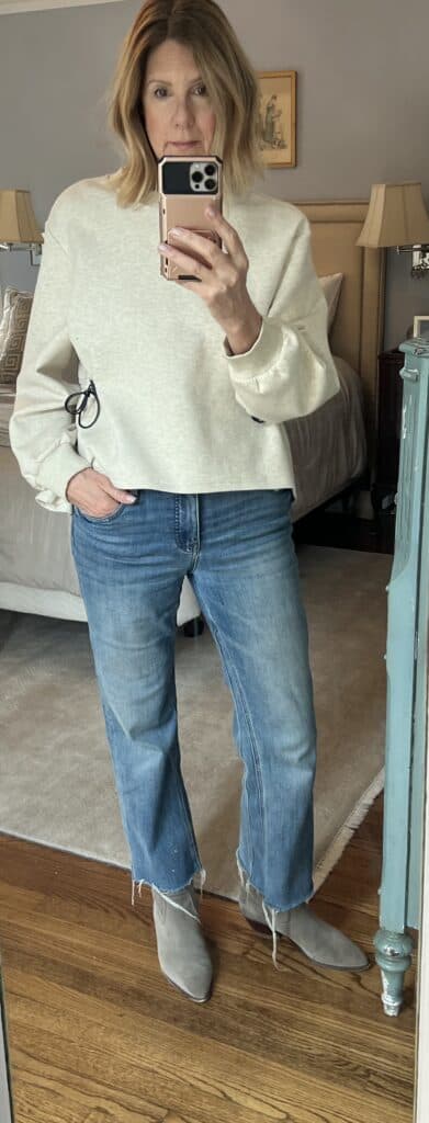 Photo of me in jeans and the same cinched sweatshirt. Demonstrating that the same top can be dressed up or down. 