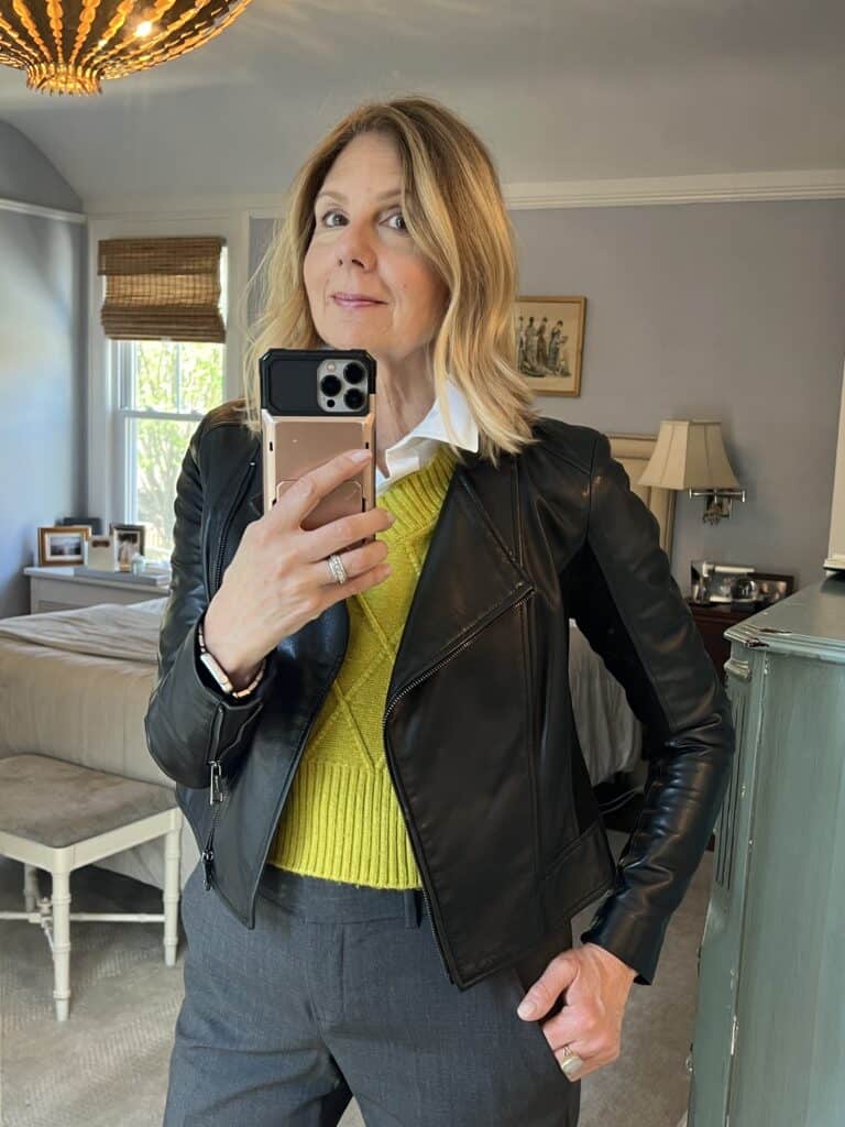 Photo of a woman in a black leather jacket. 