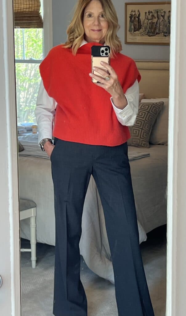 Photo of a woman  who invested in a red cashmere vest. to update her wardrobe