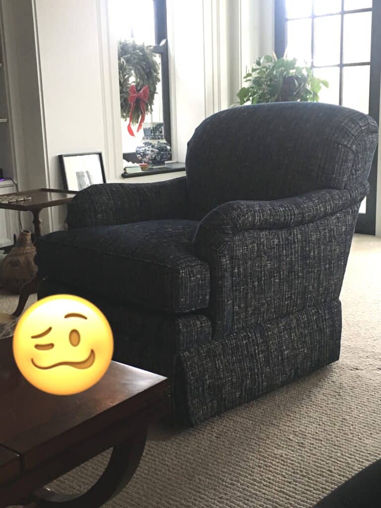 Photo of a very high chair with a "cringe-face" emoji in the frame. 