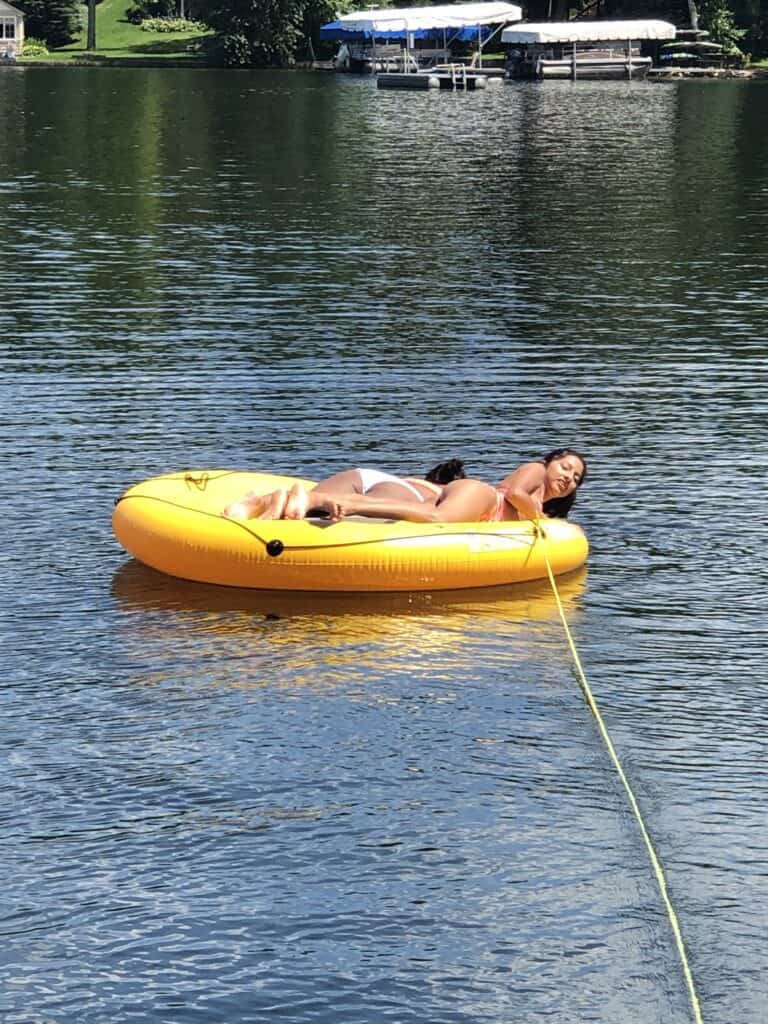 A round disk float with two people on it.