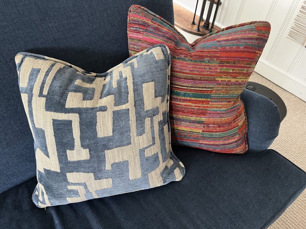 The final product, pillows made out of the fabric chosen to complete the Nancy Meyers meets Jane Goodall style.