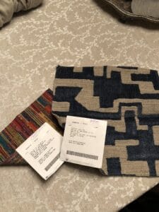 Photo of two samples of fabric that were used as accent pillows. 
