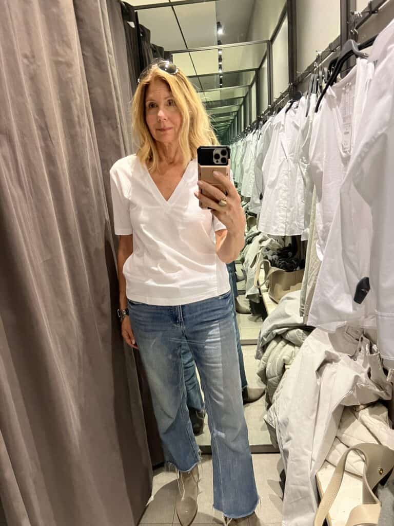 Woman in a deep V-neck t-shirt from Zara.