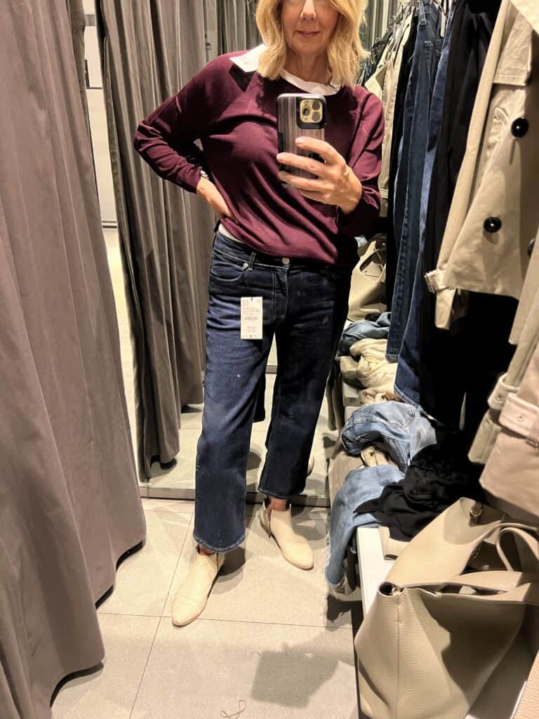 Woman trying on Zara cropped straight flare to add to her fall wardrobe. 