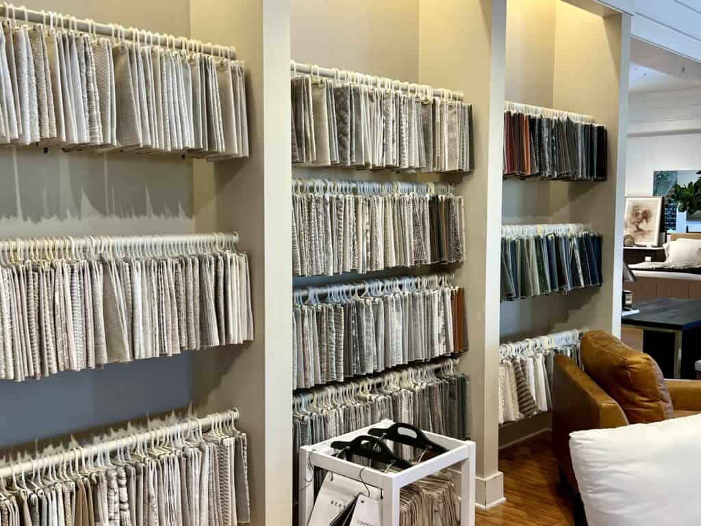 photo of a wall of fabric samples at a retail store