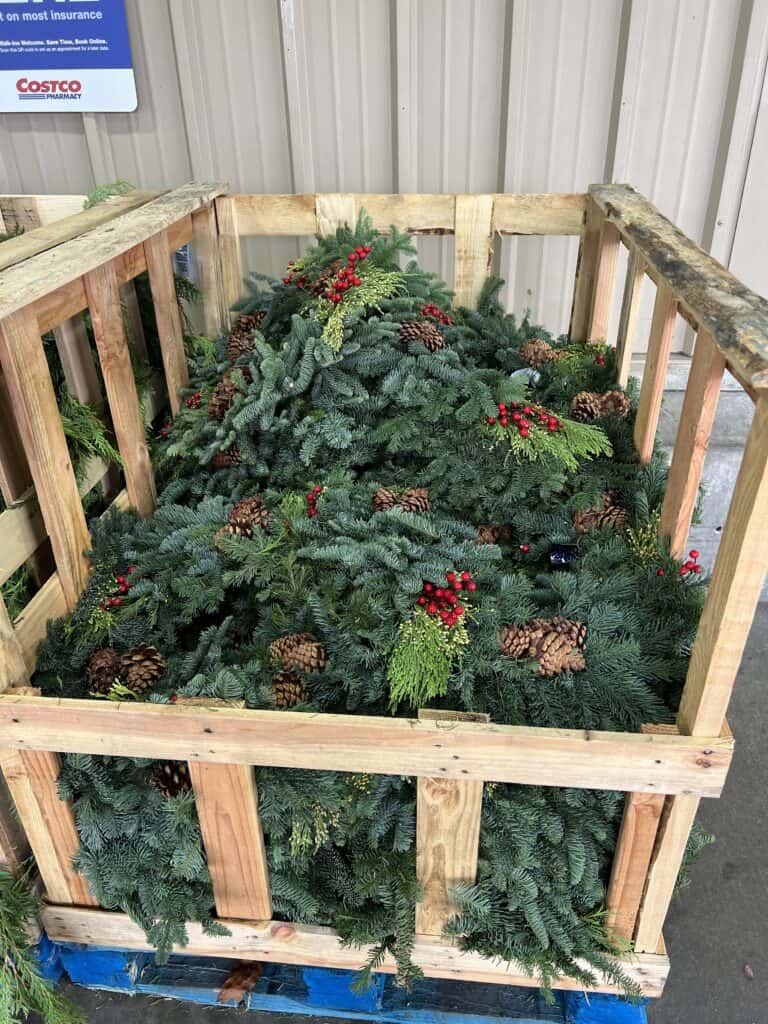 Large Costco crate filled with mixed wreaths. 