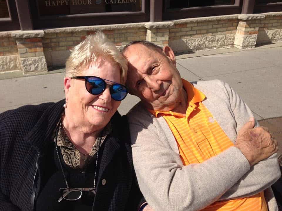 Picture of my Mom and Dad, sitting on a park bench.