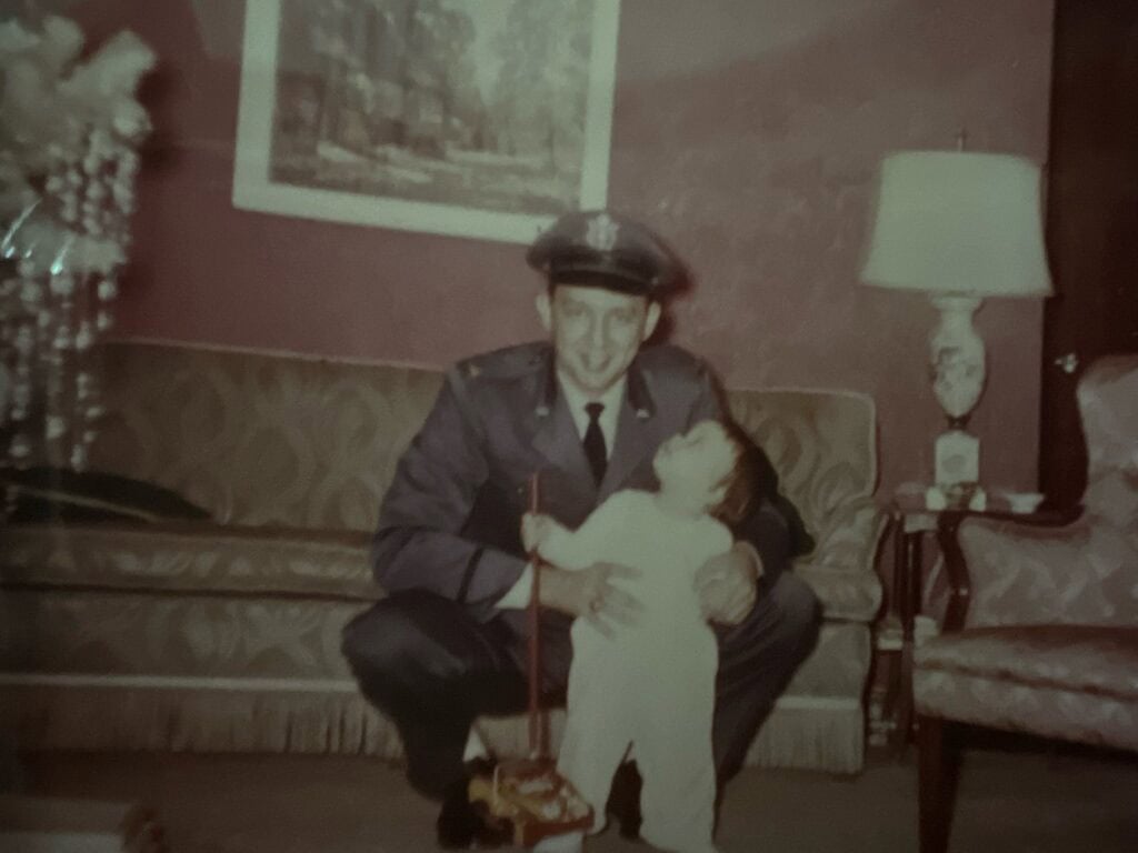 Photo of my Dad and me; he in his Air Force Uniform, me less than 1-year old. 
